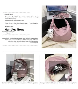 Pink nylon crescent bag size comparison with smartphone and adjustable strap details