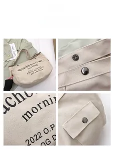 Close-up of durable metal magnetic snap fastener and canvas texture on beige tote bag