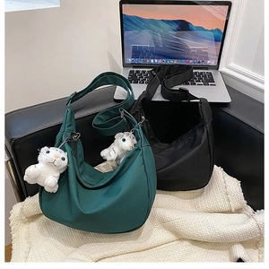 Waterproof nylon crescent crossbody bags in green and black with cute tiger charms