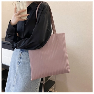 Detailed view of pink pleated tote bag with satin finish fabric and large capacity