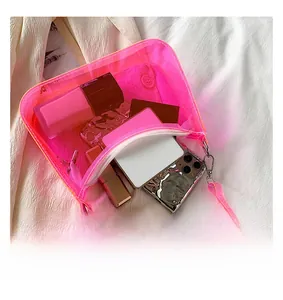 Detailed top view of pink PVC jelly bag showing its capacity for phone and cosmetics