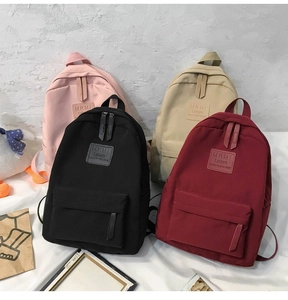 Multiple colors of MRMI Leisure nylon backpacks including pink, beige, black and burgundy