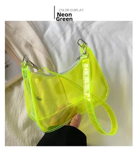 Detailed shot of neon green transparent PVC shoulder bag with metal zipper and strap