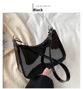 Glossy black PVC baguette bag with slim shoulder strap and silver metal buckle detail