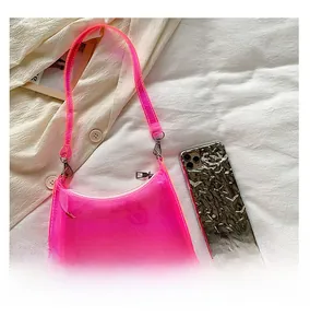 Detail view of mini neon pink transparent PVC shoulder bag with quality stitching