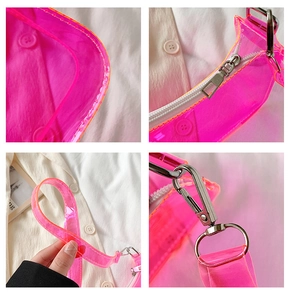 Detail of neon pink PVC jelly bag showing smooth corners, white zipper and silver metal hardware