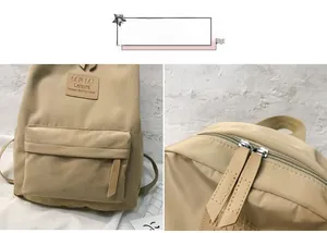 Detail view of the beige casual backpack showing premium zippers and leather logo patch