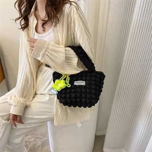 Fashionable black bubble texture handbag with yellow flower charm and white cloud pendant