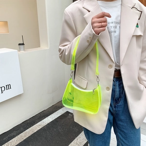 Fluorescent yellow transparent PVC shoulder bag with minimalist curved jelly design