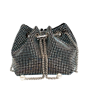 Sparkling black bucket bag with iridescent rhinestones and pearl chain strap accents
