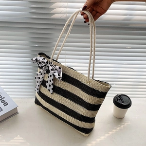 Straw woven tote bag with black and white stripes and ribbon bow for daily use