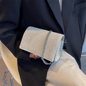 White woven textured crossbody bag with silver chain strap for summer fashion