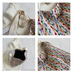 Detail view of the colorful woven fabric, leather strap and brand label on the tote bag