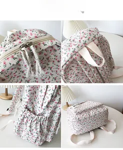 Detail view of floral backpack featuring dual metal zippers and elastic side pockets