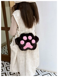 Detailed back view of a plush cat paw crossbody bag with soft faux fur and gold chain strap