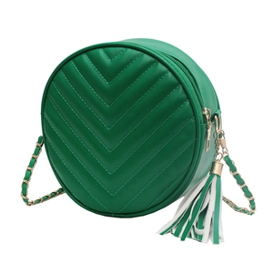 Green embroidered round crossbody bag with chevron stitching and gold chain strap