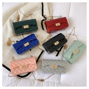 Detailed overhead view of quilted chain bags in seven vibrant colors with metal locks