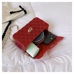 Interior view of red quilted jelly bag showing capacity for phone and cosmetics