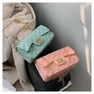 Detailed macro view of quilted texture jelly bags in mint green and soft pink