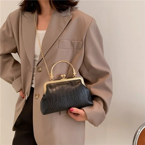 Elegant black crocodile pattern frame bag with gold handle and chain strap for women