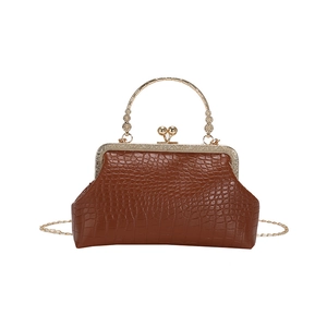 Vintage brown crocodile textured handbag with metal frame closure and chain strap