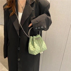 Quilted light green bucket bag with pearl drawstring and metal chain handle for women