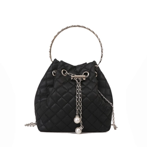 Chic black quilted bucket bag with silver metal handle and pearl chain detail
