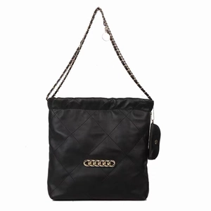 Quilted black tote bag with gold chain strap and detachable round coin purse charm
