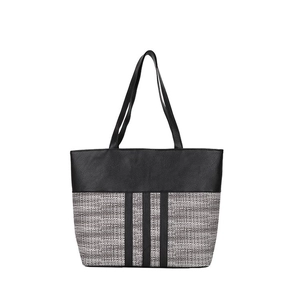 Detailed close-up of large tote bag with black pebbled leather and gray woven fabric