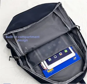 Internal view of the nylon backpack showing multiple compartments for laptop and books