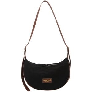 Black crescent crossbody bag with brown leather strap and checkerboard texture detail
