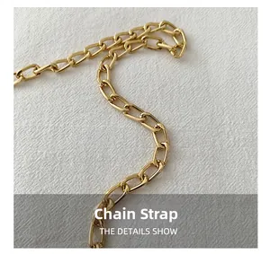 Detail shot of heavy-textured golden metal chain strap with flat oval interlocking links