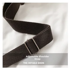 Detailed close-up of brown corduroy tote bag adjustable strap with silver metal buckle