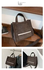 Detail view of dark coffee corduroy tote bag featuring adjustable strap and soft texture