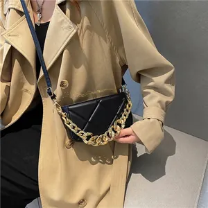 Retro black quilted crossbody bag with gold chain and adjustable shoulder strap