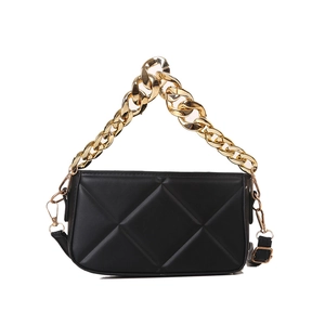 Chic black quilted crossbody bag with vintage gold chain handle and slim shoulder strap