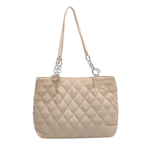 Minimalist beige quilted puffer tote bag with silver chain straps for women
