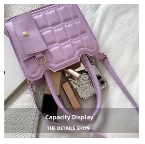 Top view of purple quilted handbag showing internal storage capacity with cosmetics
