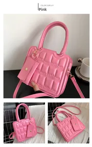 Pink quilted crossbody bag with chocolate block pattern and matching coin purse charm