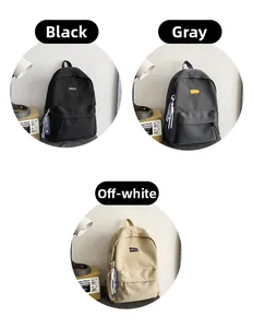 Three minimalist backpacks in black, grey, and off-white with front zipper pockets