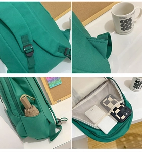 Detail view of green nylon backpack showing reinforced straps and internal mesh pockets