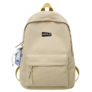 Minimalist cream canvas backpack for students with large front pocket and sport tag