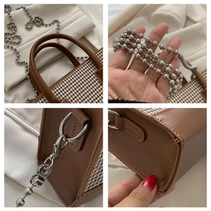 Detailed close-up of houndstooth fabric texture and silver chain strap on a small handbag