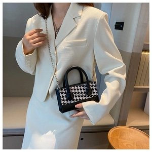 Women's checkerboard pattern mini tote bag with silver chain strap and black leather handles