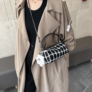 Chic black and white tweed cylinder crossbody bag with chain strap and cloud charm
