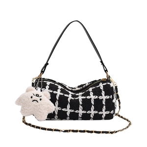 Classic black and white tweed plaid underarm bag with gold chain and plush star charm