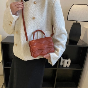 Minimalist brick red square handbag with wave pattern and adjustable strap for women