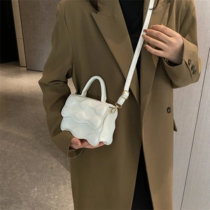 White cloud-shaped crossbody bag with glossy PU leather and adjustable shoulder strap