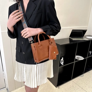 Chic caramel square shoulder bag with retro geometric wide strap and mini coin purse charm