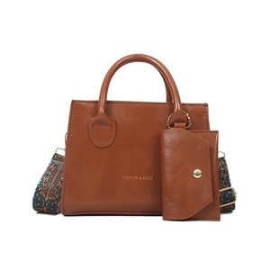 Vintage brown PU leather crossbody bag with a patterned wide strap and a small coin pouch